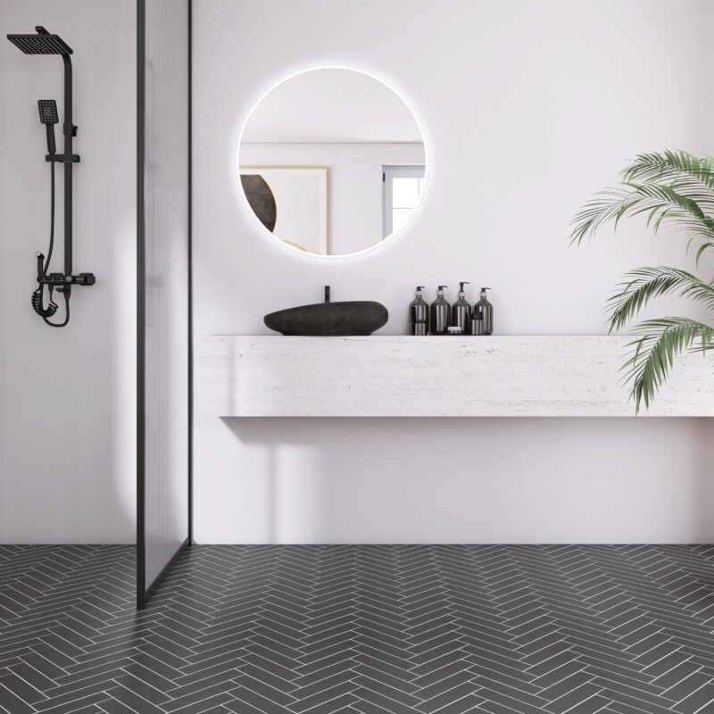 Room scene of UMORE Classico Graphite Porcelain Herringbone Mosaic Tile installed on the floor